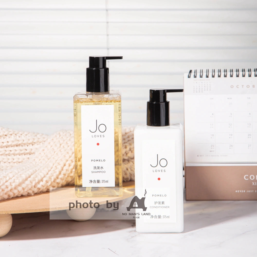 two bottles of JO-LOVES-POMELO-shampoo-conditioner