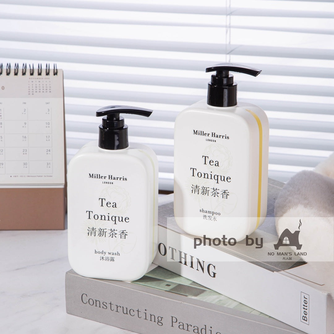 2 bottles of Miller Harris shampoo and shower gel displayed on the tray.