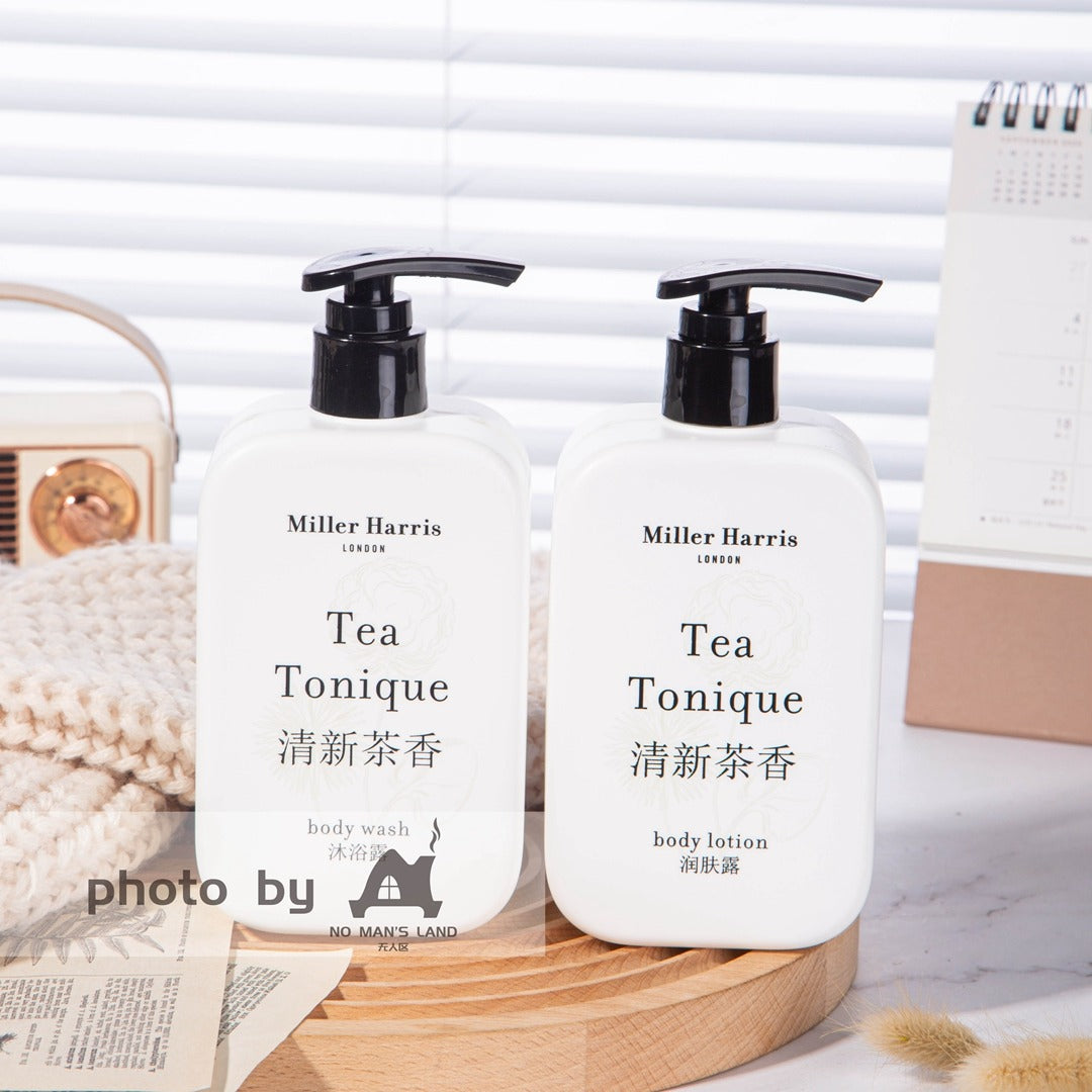 2 bottles of Miller Harris body wash and body lotion displayed on the tray.