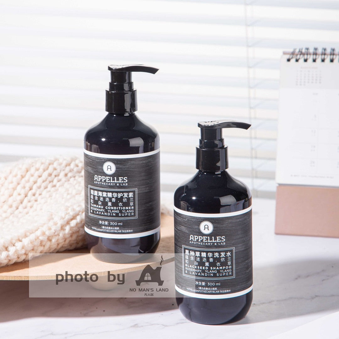 two bottles of APPELLES Nigella Sativa shampoo and conditioner.