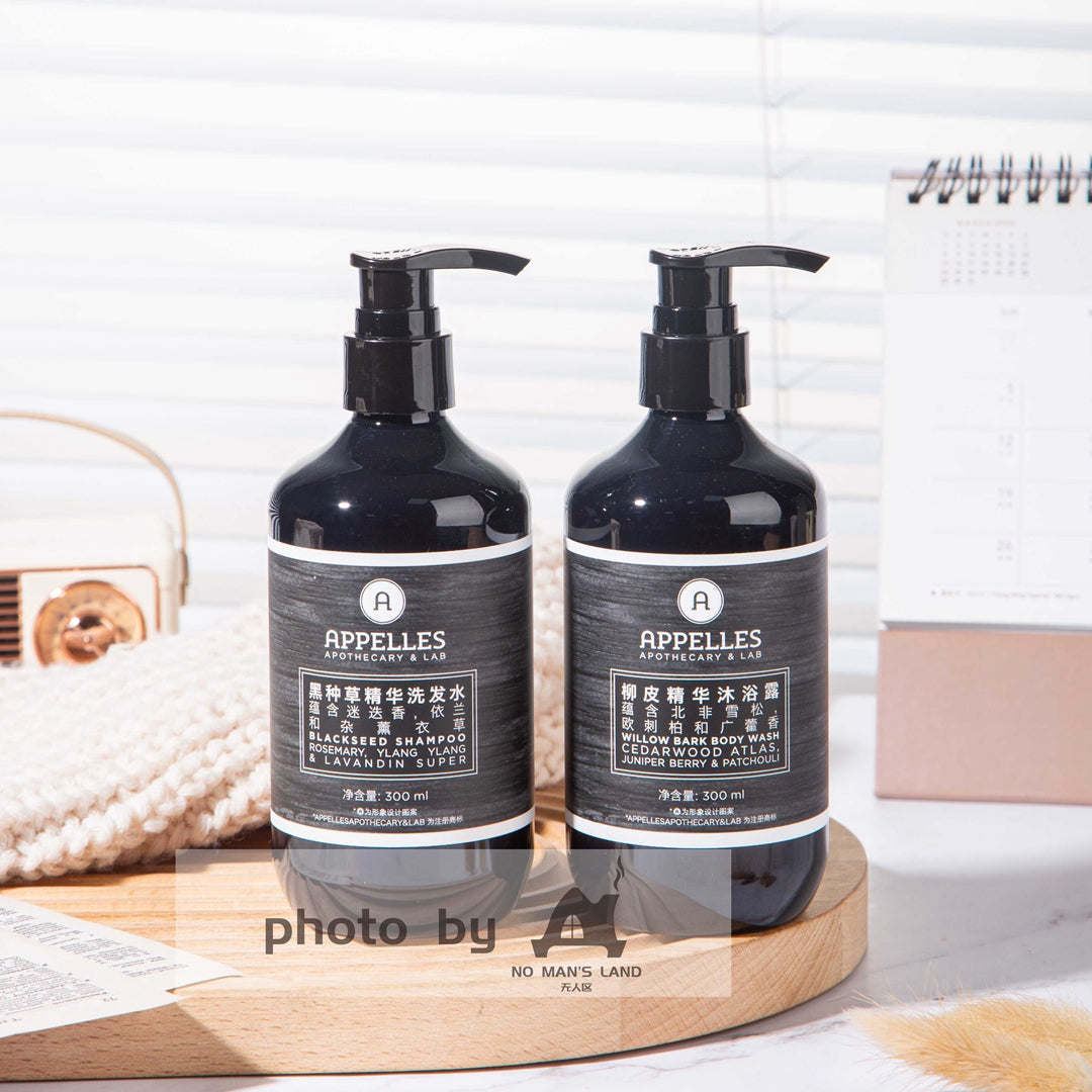 two bottles of APPELLES Nigella Sativa shampoo and shower gel.