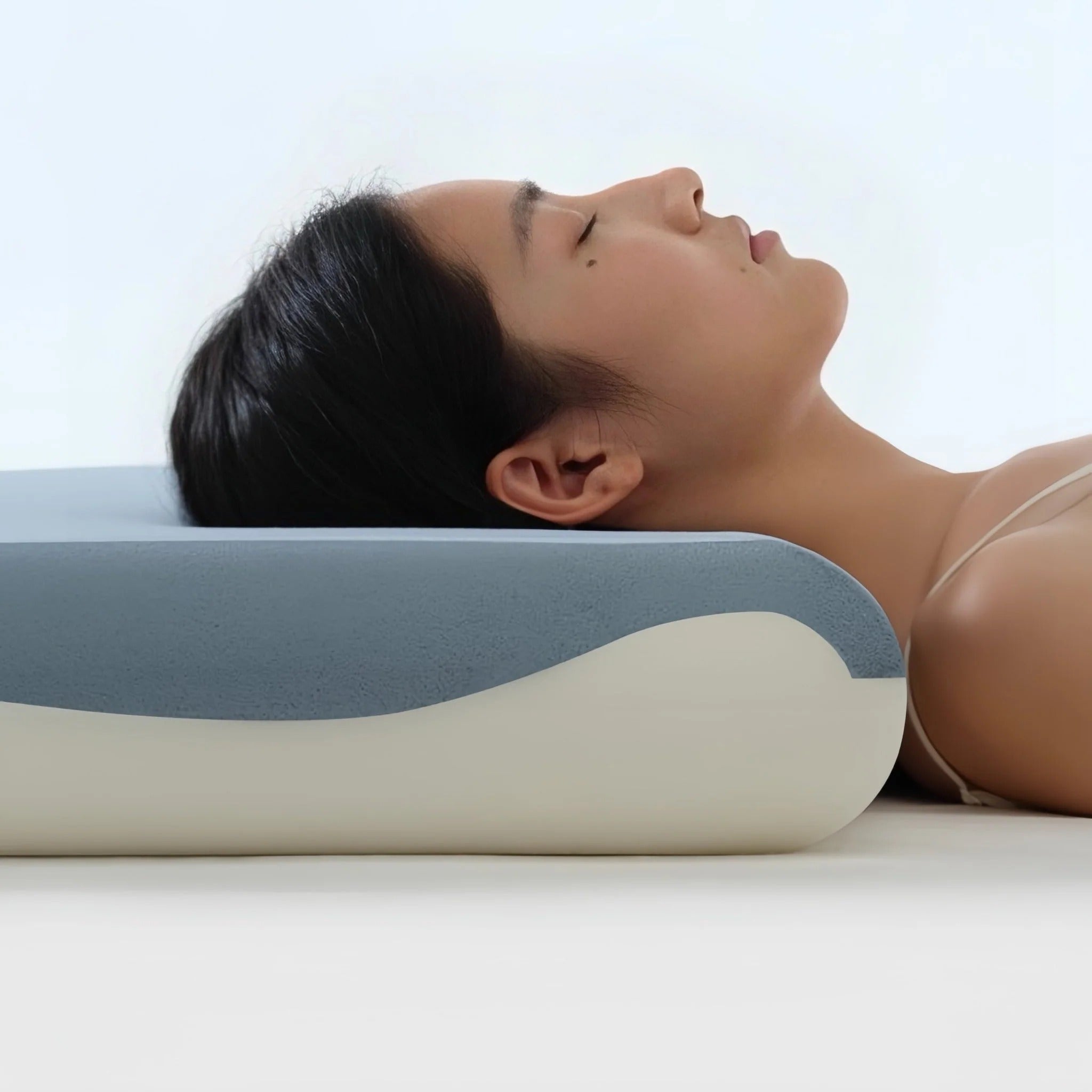 Side view showing the girl's neck lying on the Atour pillow