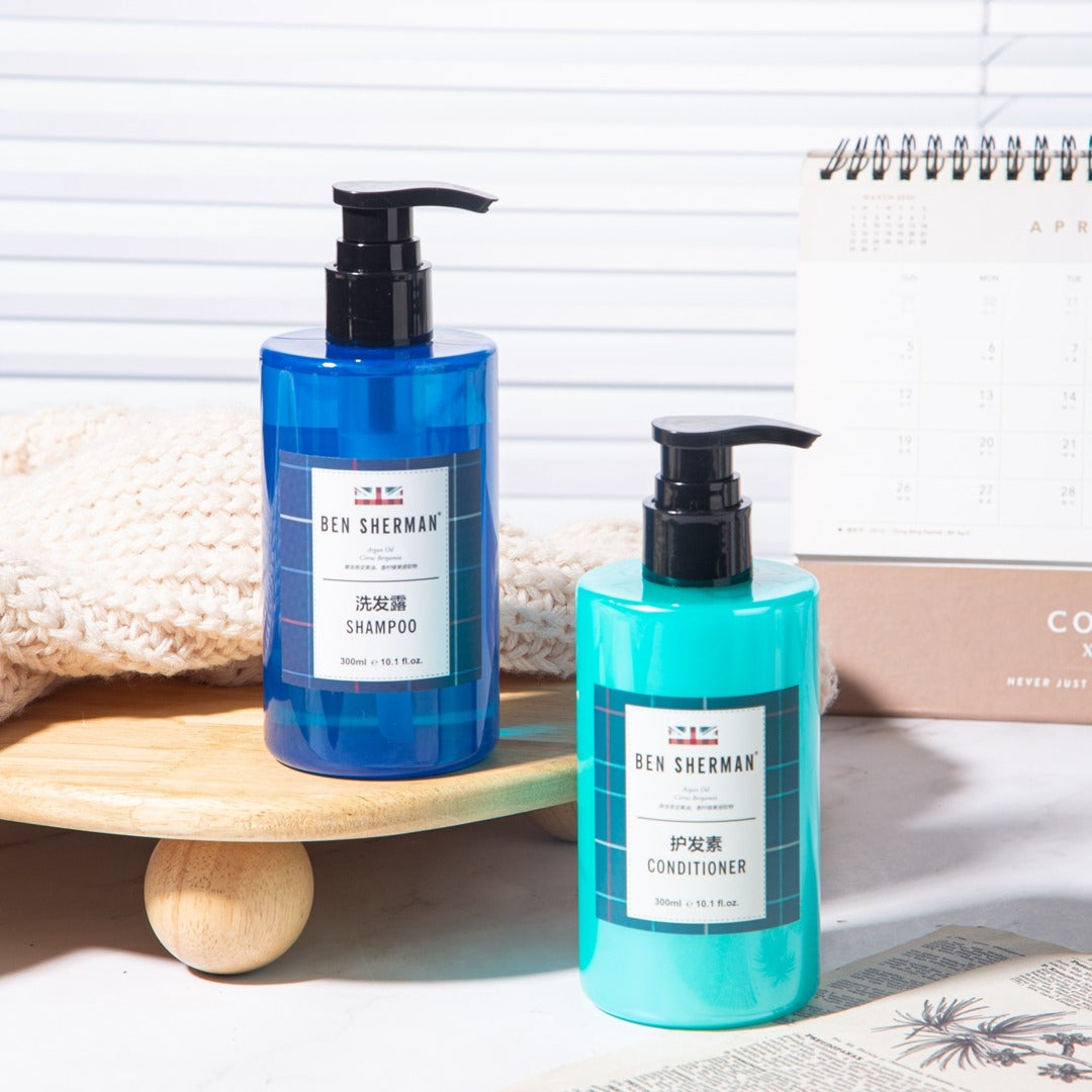 two bottles of BEN SHERMAN hotel shampoo and conditioner.