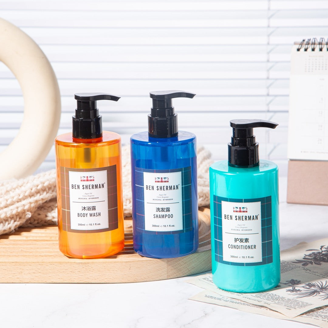 three bottles of BEN SHERMAN hotel toiletries.