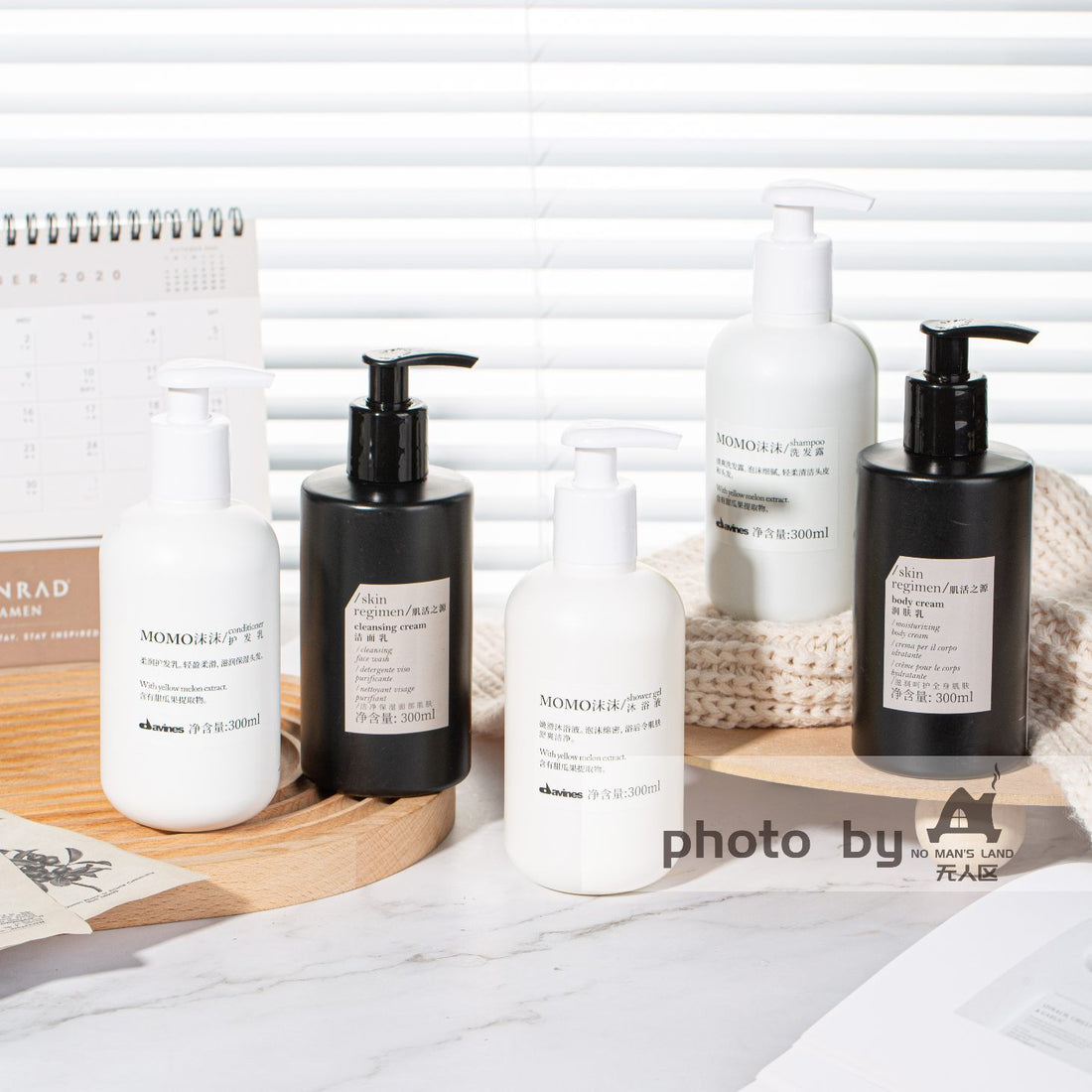 5 bottles of DAVINES MOMO hotel toiletries displayed.