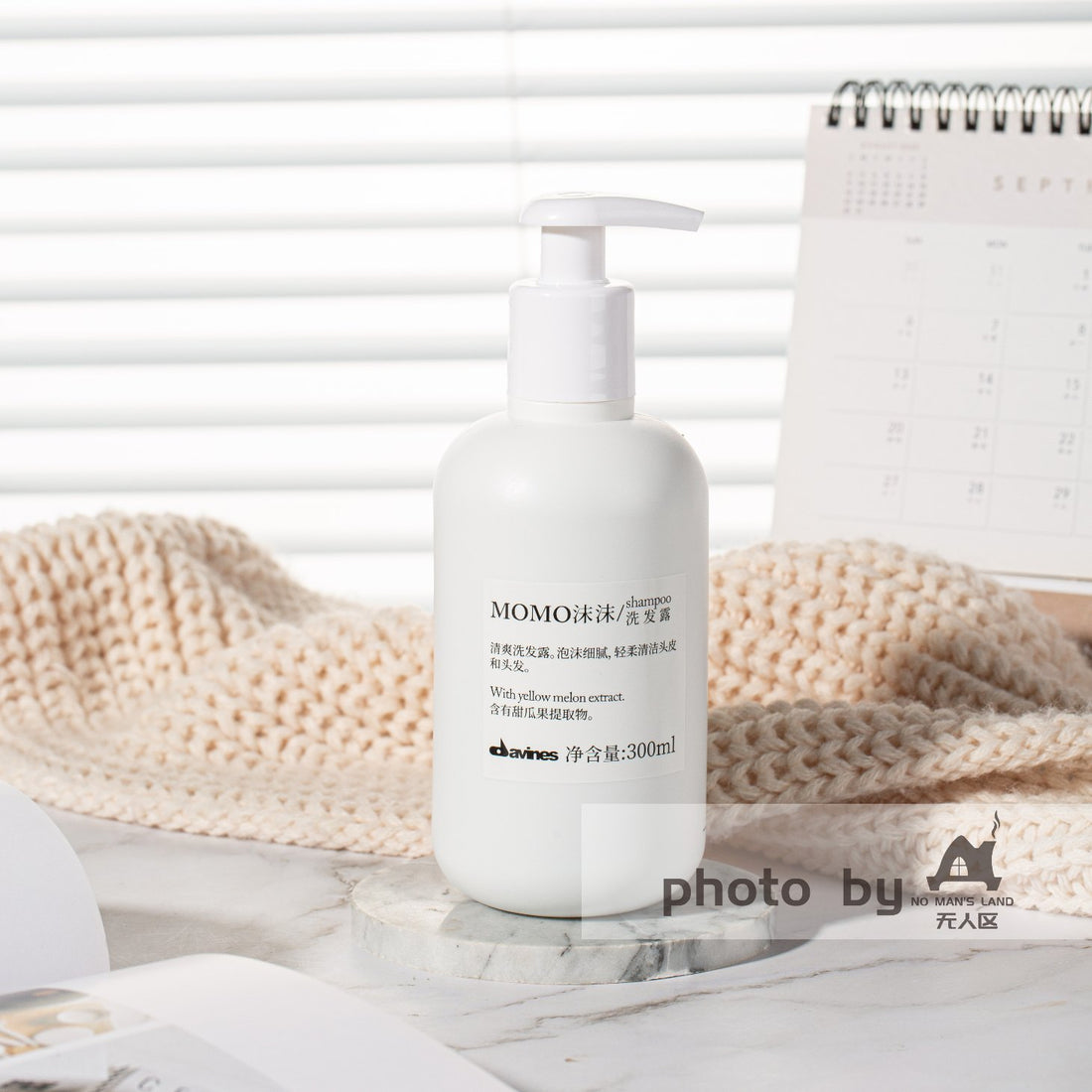 one bottle of DAVINES MOMO shampoo displayed.