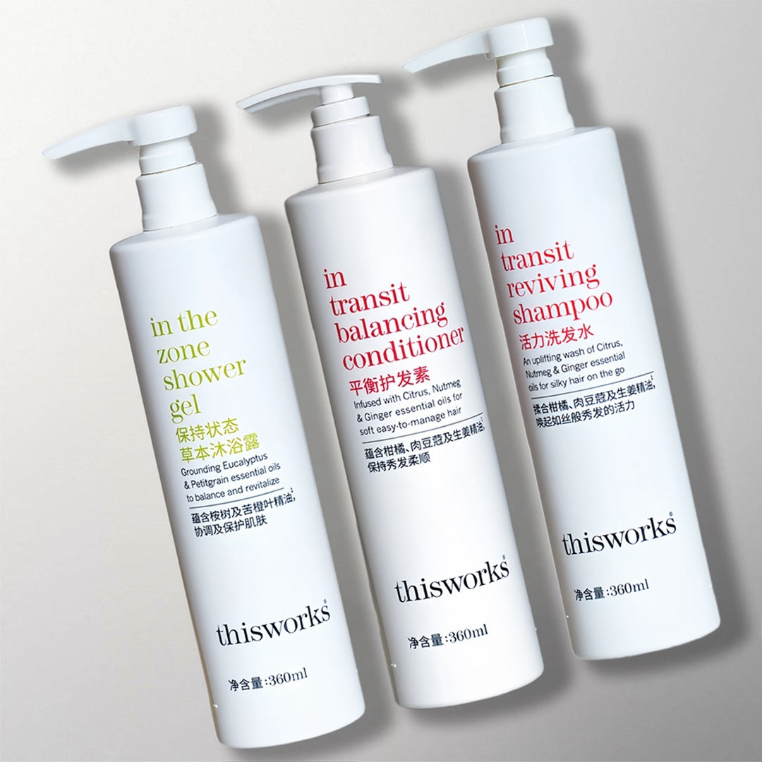 three bottles of thisworks toiletries.