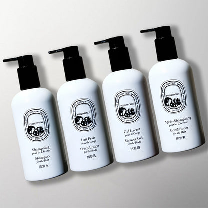4 bottles of The Ritz-Carlton Hotel toiletries.